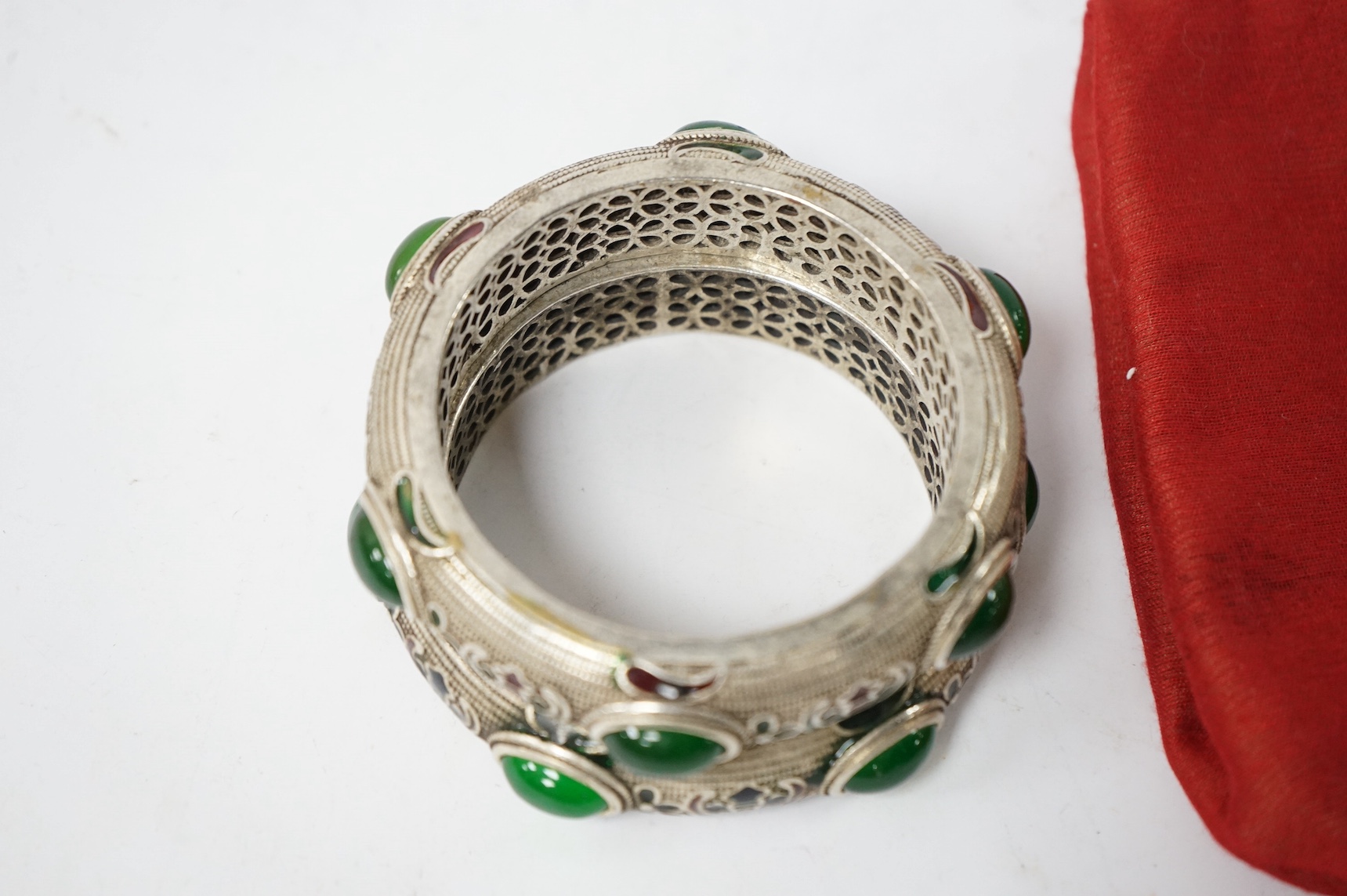 A pair of Mongolian metal and enamel bangles, 8.5cm diameter. Condition - good